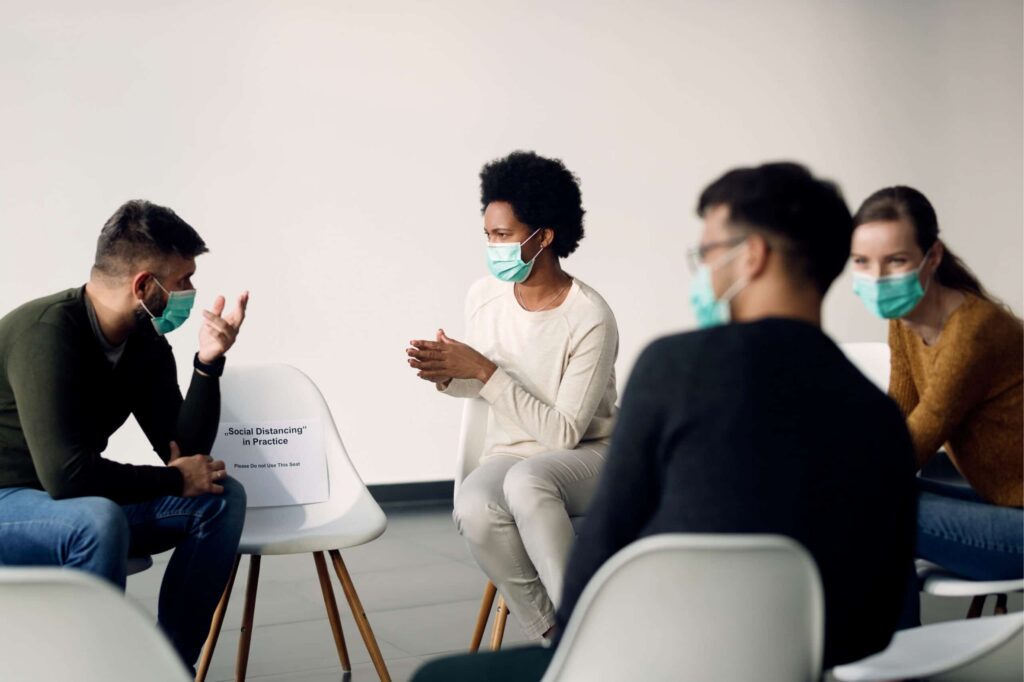 Support Group Social Distanced and Wearing Masks