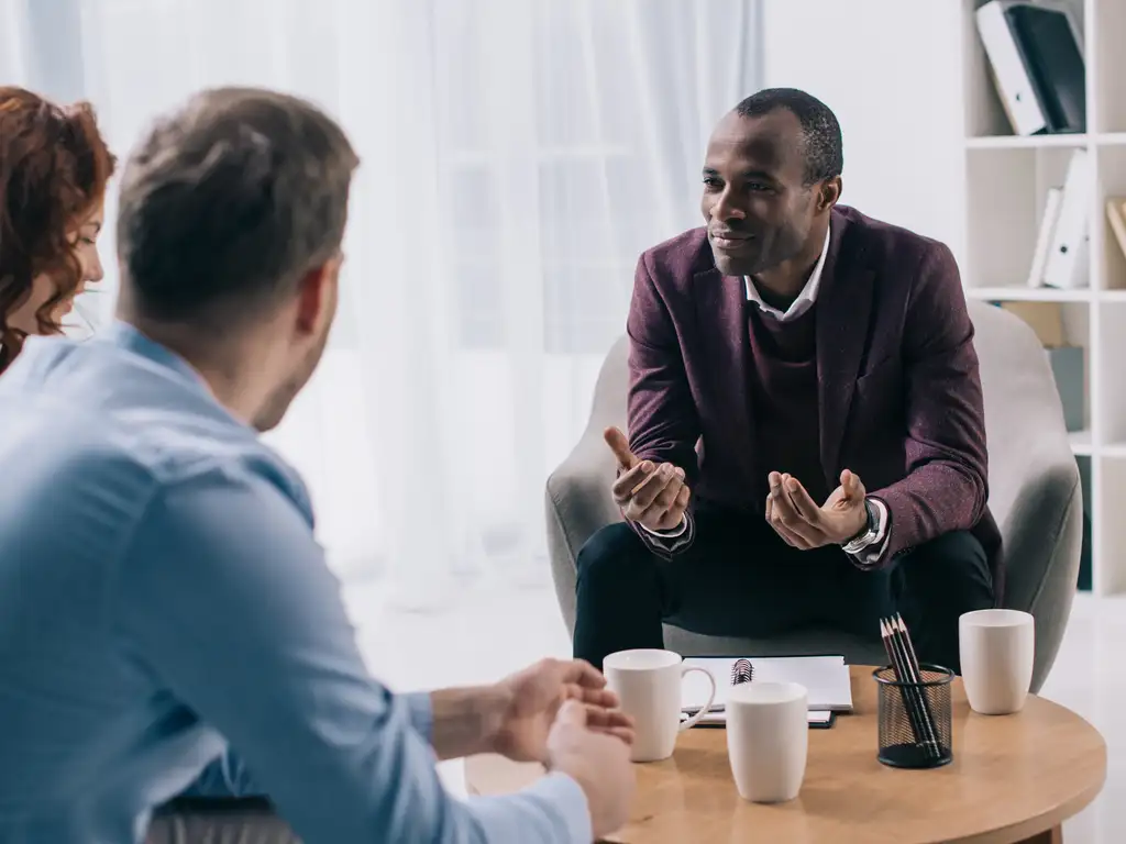 A Dr And Patients Discussing Schizophrenia And Depression At | Care Plus New Jersey